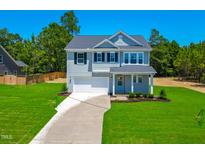 Charming two-story home with a well-manicured lawn and a classic architectural style at 355 Beacon Hill Rd # 23, Lillington, NC 27546