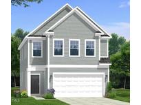 Charming two-story home featuring gray siding, white trim, and an attached two-car garage at 195 Steel Spring Ln # 20, Angier, NC 27501