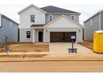 New two-story home featuring an attached two-car garage and a light-colored siding exterior at 2230 Cherry Creek Rd, Haw River, NC 27258