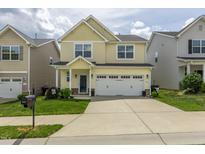 Charming two-story home with a well-manicured lawn and a two-car garage, perfect for suburban living at 4024 Dunkirk Dr, Burlington, NC 27215