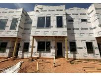 Under construction exterior of new townhome with visible framework and protective wrapping at 1521 1/2 Sunrise Ave, Raleigh, NC 27608
