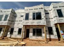 New construction townhome featuring modern architectural details, large windows, and durable weather-resistant wrap at 1523 Sunrise Ave, Raleigh, NC 27608