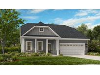 Charming one-story home featuring stone accents, well-manicured lawn, and a two-car garage at 2000 Clydner Dr, Apex, NC 27523