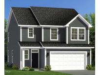 Charming two-story home featuring a two-car garage, gray siding, and white trim, creating a welcoming curb appeal at 230 Steel Spring Rd # 49, Angier, NC 27501