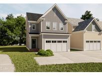 Charming two-story home featuring gray siding, black roof, and a two-car attached garage at 1036 Harper Rd, Raleigh, NC 27603