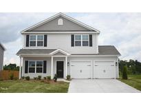 Charming two-story home with a two-car garage, black shutters, and landscaping at 1036 Thicket Dr # 221, Burlington, NC 27217