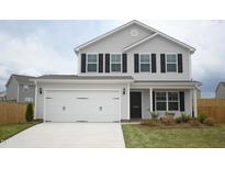 Charming two-story home with light grey siding, black shutters, and a spacious two-car garage at 1069 Thicket Dr # 355, Burlington, NC 27217