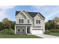 Charming two-story home with stone accents, gray siding, and a covered front porch at 1244 Hazelnut Ridge Ln, Knightdale, NC 27545