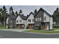 Modern exteriors showcasing sleek, two-story homes with contrasting textures and contemporary design elements at 1800 Pershing Rd, Raleigh, NC 27608