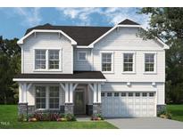 Charming two-story home with white siding, stone accents, and a welcoming covered porch at 1931 Ballard Rd, Fuquay Varina, NC 27526