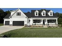 Inviting curb appeal with stone accents and a well-maintained lawn at 253 Busterfield Ct, Benson, NC 27504