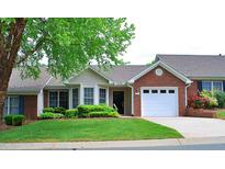 Charming single-story home featuring well-maintained landscaping and an attached one-car garage at 3027 Maple Ave # Apt K3, Burlington, NC 27215