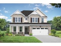 Charming two-story home with stone accents, manicured lawn, and attached two car garage at 416 Longleaf Glen Ln, Zebulon, NC 27597