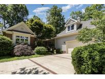 Beautiful home featuring a two-car garage and meticulously maintained landscaping at 27425 Walker, Chapel Hill, NC 27517