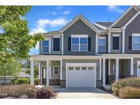 Charming townhome with stylish architectural details and an attached one-car garage at 172 Wellons Creek Dr, Garner, NC 27529
