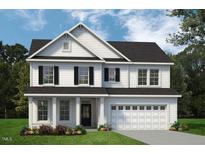 Charming two-story home with black shutters and a two-car garage, surrounded by a well-manicured lawn at 1913 Ballard Rd # 193, Fuquay Varina, NC 27526