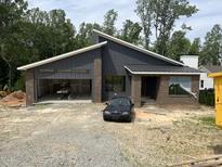 Modern home featuring brick and a 2-car garage at 269 Deer Tail Ln # 44, Fuquay Varina, NC 27526