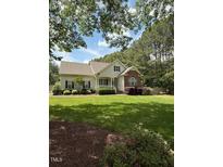 Charming home with a well-manicured lawn and beautiful landscaping at 2833 Praire View Pt, Wendell, NC 27591