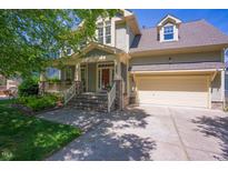 Charming home featuring a well-maintained front yard, covered porch, and attached two-car garage at 1097 Trentini Ave, Wake Forest, NC 27587
