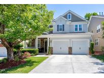 Beautiful two-story home with a two car garage and a well-manicured lawn, perfect for families at 1141 Brookhill Way, Cary, NC 27519