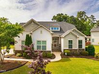 Charming single-story home boasts a well-manicured lawn and welcoming entrance at 2910 Reynolda Cir, Durham, NC 27712