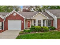 Charming brick and siding home with a well-manicured front lawn and attached garage at 3027 Maple Ave # M2, Burlington, NC 27215