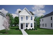 Charming two-story home with white siding, black door, a small porch, and manicured landscaping at 336 White Oak Garden Way # 222, Garner, NC 27529