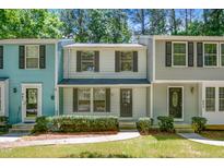 Charming townhomes with colorful siding and well-maintained landscaping at 603 Middleton Ave, Cary, NC 27513