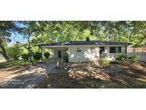 Charming single-story home featuring a covered carport and a well-maintained front yard at 626 Hoover Rd, Durham, NC 27703