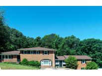 Charming two-story brick home with lush landscaping and a classic design at 1509 Logan St, Durham, NC 27704