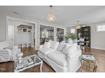 Bright and airy living room with hardwood floors and open floor plan showcasing modern interior design at 43 Quarter Gate Trce, Chapel Hill, NC 27516