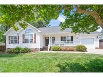 Charming single-story home with a well-manicured lawn and inviting front porch at 901 N Taylor St, Wake Forest, NC 27587