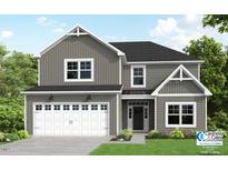 Charming two-story home with gray siding, white trim, a two-car garage, and well-manicured lawn at 15 Malbec Way, Youngsville, NC 27596