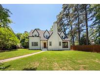 Charming two-story home with a manicured lawn and traditional architectural details at 2515 W Club Blvd, Durham, NC 27705