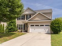 Charming two-story home featuring a two-car garage, well-maintained lawn, and classic design elements at 2605 Mcdougall Dr, Burlington, NC 27217