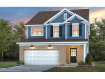 Charming two-story home with a brick and siding exterior, featuring a two-car garage and professionally landscaped yard at 425 Providence Springs Ln, Fuquay Varina, NC 27526