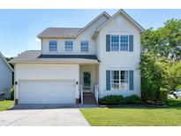 Charming two-story home with a well-maintained lawn, attached garage, and inviting curb appeal at 4725 Parr Vista Ct, Raleigh, NC 27612
