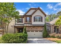 Charming two-story home with stone accents, manicured landscaping, and a two-car garage at 644 Angelica Cir, Cary, NC 27518