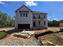 Unfinished two-story home featuring an attached two-car garage ready to be built on a lovely lot at 15 Guardian St, Youngsville, NC 27596