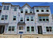 New construction townhome with a modern design and many windows in a desirable community at 348 Chesapeak Commons St # 137, Garner, NC 27529