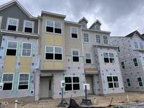 New construction townhouse showcasing Mungo Homes construction under a cloudy sky at 364 Chesapeak Commons St # 133, Garner, NC 27529