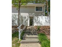 Inviting two-story home featuring well-maintained front yard and a charming walkway to the front door at 7177 Sandy Creek Dr, Raleigh, NC 27615