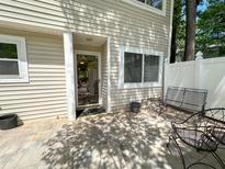 Enjoy this outdoor patio with stylish seating, great for relaxing or entertaining guests at 7177 Sandy Creek Dr, Raleigh, NC 27615
