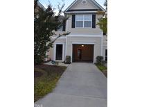 Two-story home featuring an attached garage and manicured landscaping at 958 Shining Wire Way, Morrisville, NC 27560