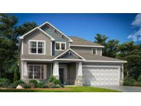 Charming two-story home featuring gray siding, a two-car garage, and a welcoming front porch at 162 Sugar Pine Drive, Franklinton, NC 27525