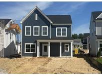 Charming two-story home features a welcoming front porch and classic architectural details at 261 Marvel Dr # 136, Rolesville, NC 27571