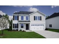 Charming two-story home featuring a gray exterior, black shutters, and a two-car garage at 315 Alice Trace Place, Angier, NC 27501