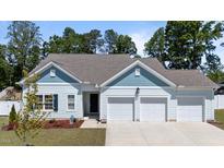 Charming home featuring a three-car garage and beautifully manicured lawn at 412 Kavanaugh Rd, Wake Forest, NC 27587