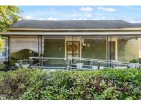 Charming front porch with wheelchair ramp, decorative wreath, and quaint details at 204 Heck St, Raleigh, NC 27601