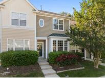 Charming townhouse featuring a well-maintained lawn and mature landscaping around the front at 3711 Ramblewood, Durham, NC 27713